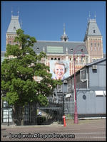 Queen Beatrix peeks out from the Rijksmuseum