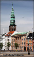 Nikolaj Kirke towering over a city street